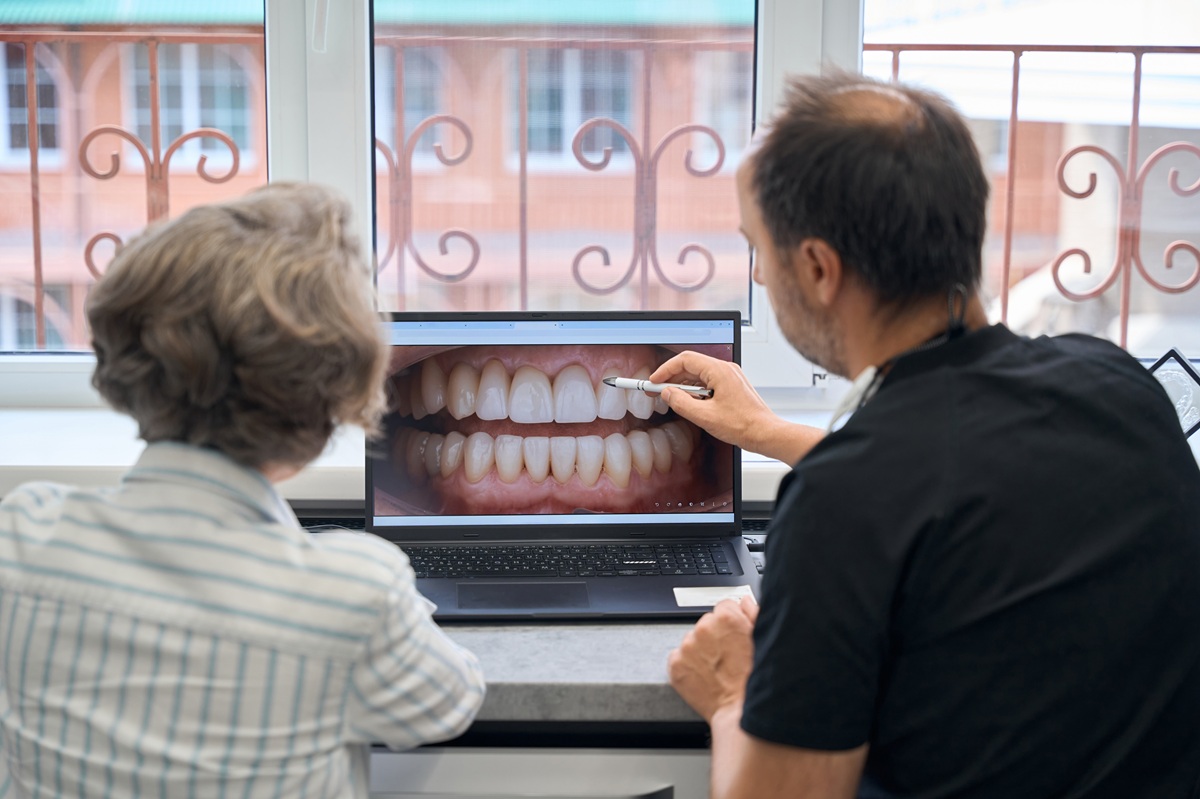 Dentist showing cosmetic dental results